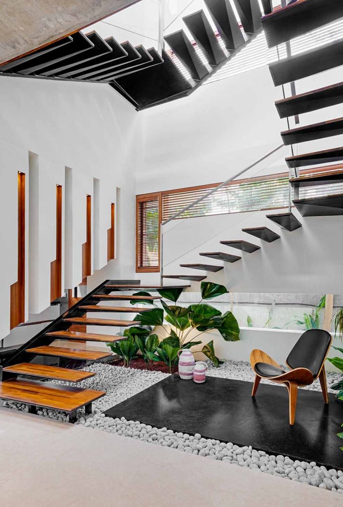 Metal staircase design that is cantilevered from a suspended wall. 