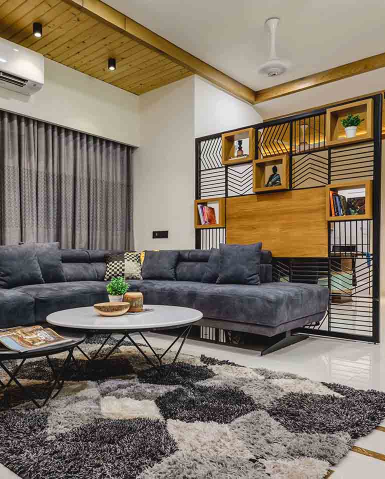 Bungalow design:  the wooden and metal divider with straight lines creating an abstract pattern breaks the line of vision between the living and dining.
