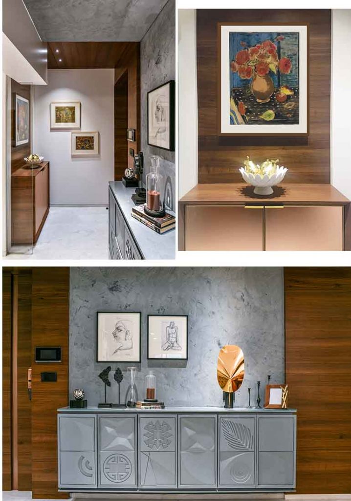A vaulted veneer wrapped door acts as an entryway to the bedrooms.  The grey console with abstract engraved panels in concrete grey finish wrap upto the ceiling, 