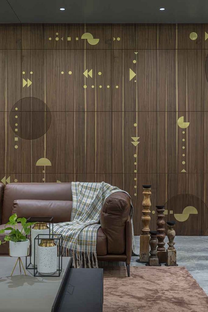 Wall cladding in the informal living area combines traditional elements with progressive designs based on simple geometric patterns.  